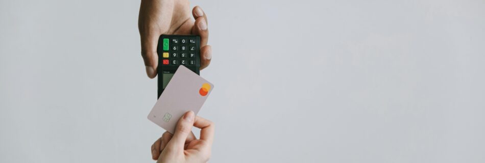 Modern contactless payment using a card and terminal, highlighting the ease of digital transactions.